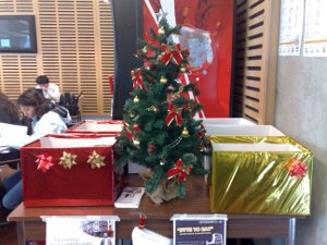 Table with boxes and Christmas tree